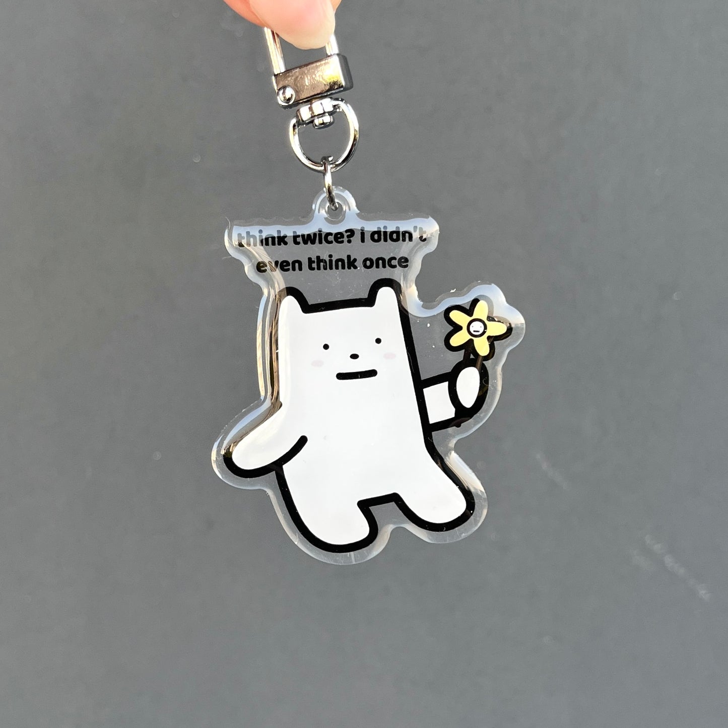waterproof bear acrylic keychain with the text “Think twice? I didn't even think once" on a plain background