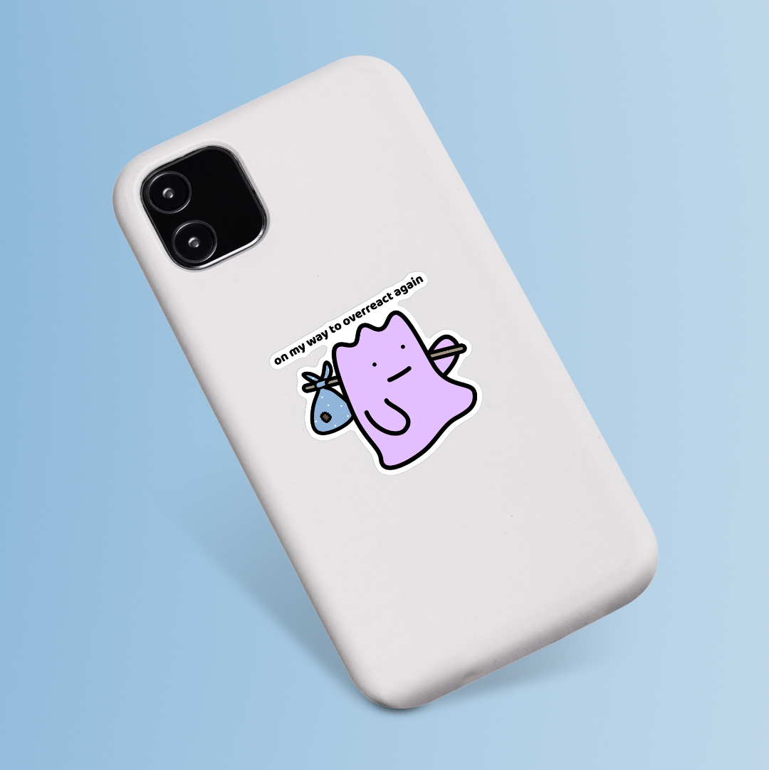 waterproof vinyl sticker with the text āOn my way to overreact again" on a phone case