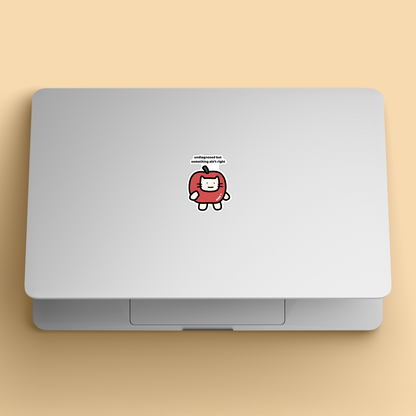 waterproof apple cat vinyl sticker with the text "Undiagnosed but something ain't right" on a laptop