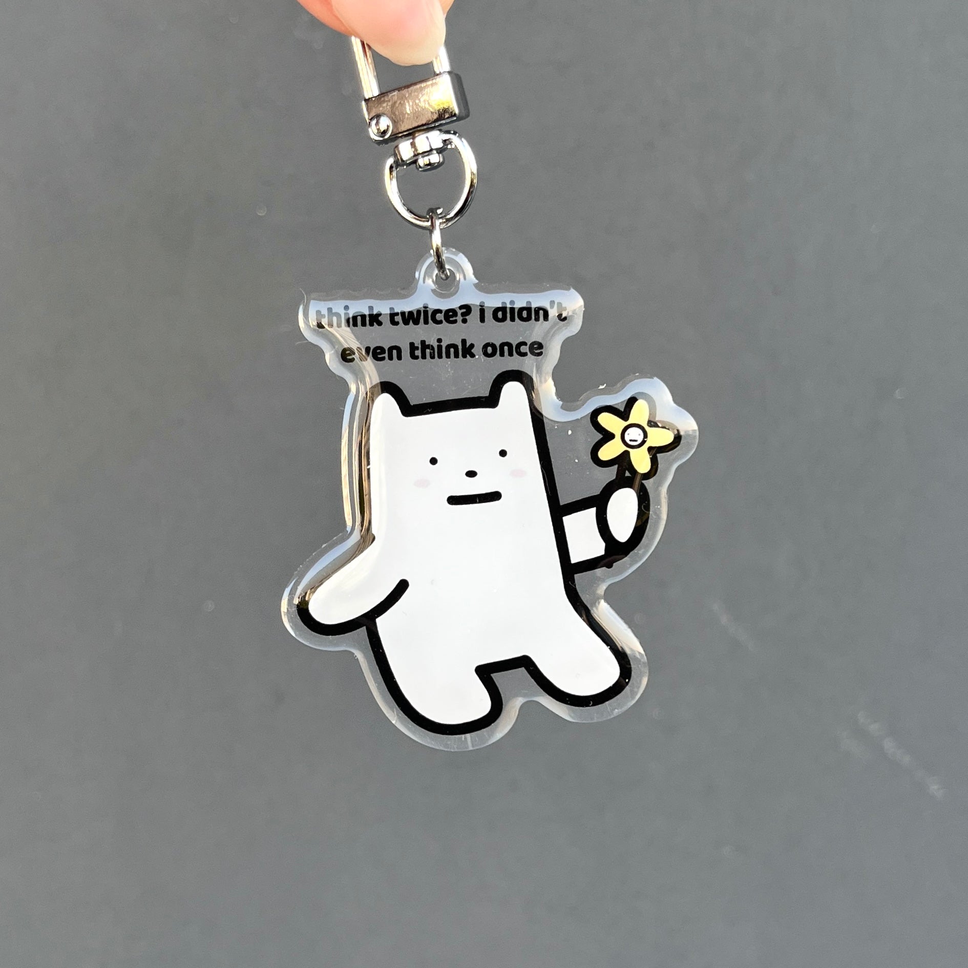 waterproof bear acrylic keychain with the text “Think twice? I didn't even think once" on a plain background