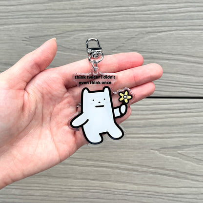 waterproof bear acrylic keychain with the text “Think twice? I didn't even think once" on a person's hand
