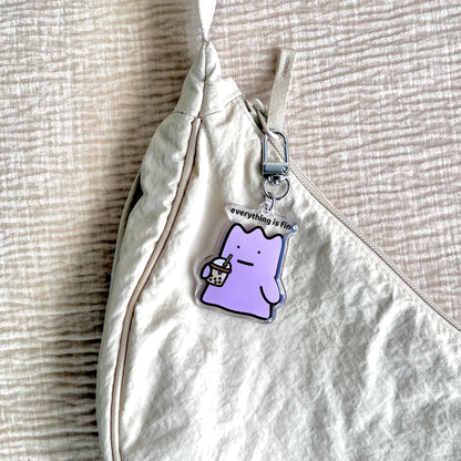 waterproof bubble tea acrylic keychain with the text “Everything is fine" on a bag