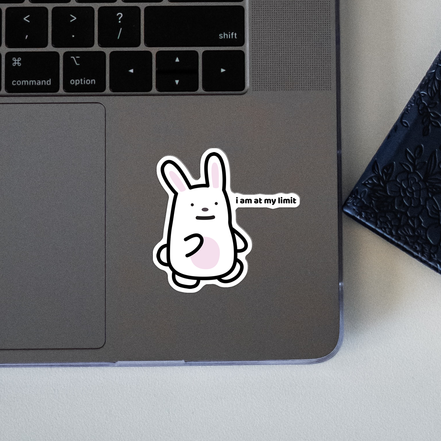 closeup of waterproof bunny vinyl sticker with the text "I am at my limit"