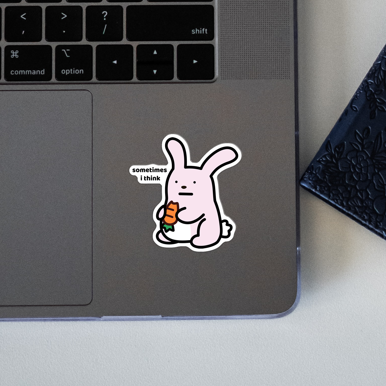closeup of waterproof bunny vinyl sticker with the text “Sometimes I think"