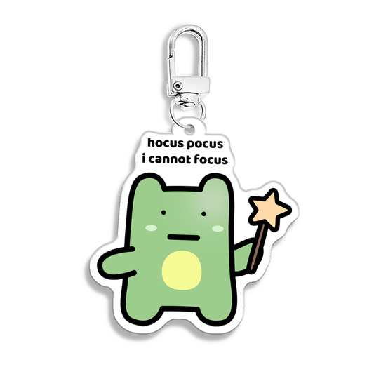 waterproof frog acrylic keychain with the text “Hocus pocus I cannot focus"