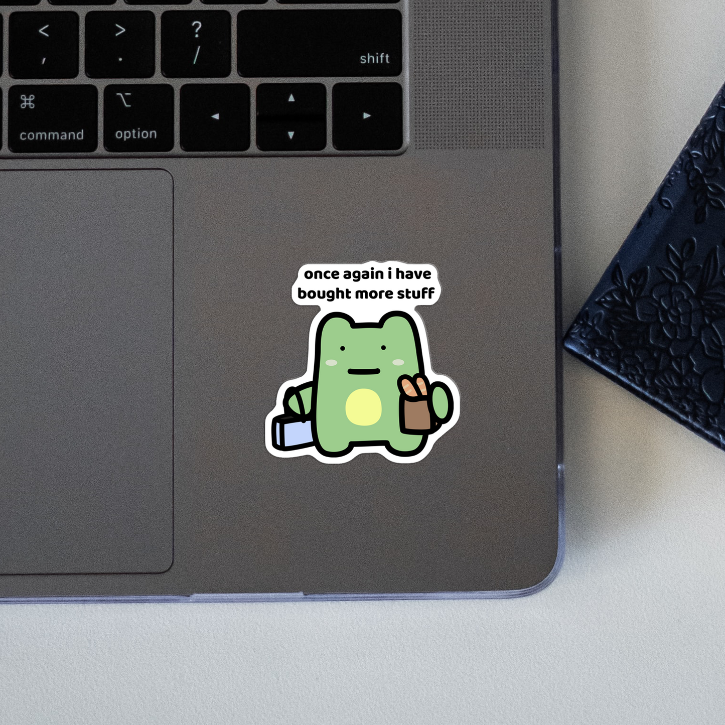 closeup of waterproof frog vinyl sticker with the text "Once again i have bought more stuff"