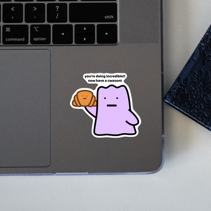 closeup of waterproof vinyl sticker with the text “Youre doing incredible!! Now have a cwasont"